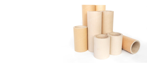 Pressed paper cylindrical tubes, on an isolated white background, with copy space