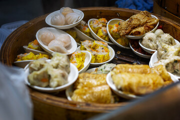 Dumplings and other local food at a Hong Kong market. Appetizing products. Close-up.