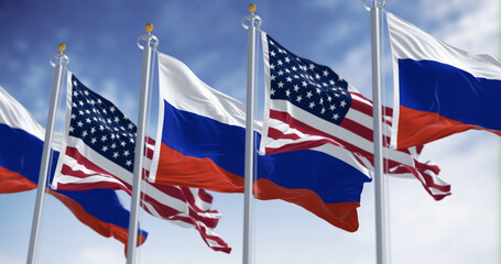 Obraz premium National flags of Russia waving in the wind on a clear day