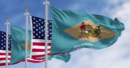 Delaware state flag waving with the national american fla