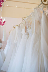 Beautiful bridal dress on hangers