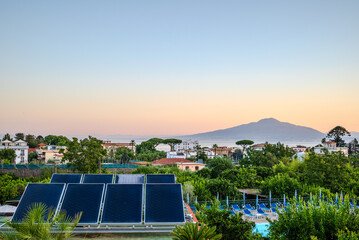 Pre-dawn rooftop view over Sorrento, Italy, capturing the tranquil vacation atmosphere of the coastal town