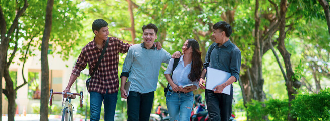 Group of Diversity Student working and walking together in park at university,Happy multiethnic...