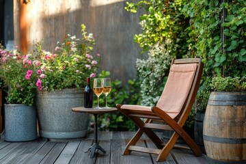 Fototapeta premium Garden chair near a table on green terrace. Table with glasses of wine. Cozy balcony