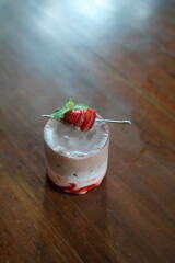 Delicious chocolate strawberry drink with fresh mint garnish creating a refreshing and vibrant vibe for summer promotions and cafe menus