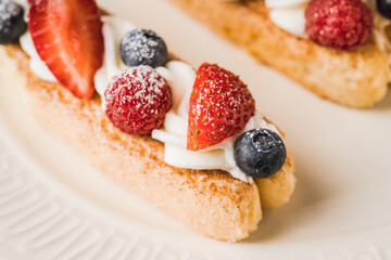 Tiramisu-style dessert with savoiardi, cream cheese and berries. Sweets and desserts.