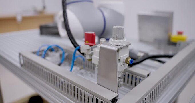 Electronic sensor system and wiring on control unit for collaborative robot training setup in robotics lab during industrial automation workshop for smart factory engineering demonstration