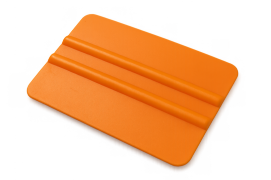 Orange plastic squeegee tool for vinyl application - Powered by Adobe