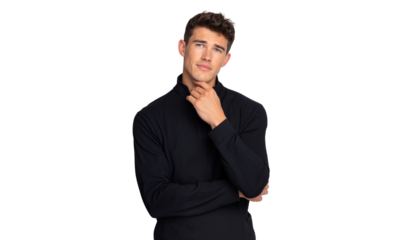 Thoughtful handsome young man in black turtleneck, hand on chin, looking up, isolated on white background