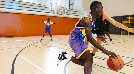 Naklejka premium Basketball players competing in a game