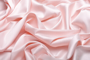 Obraz premium Close-up of luxurious baby pink acetate satin fabric, heavily draped and folded to showcase its silky texture, rich luster, and flowing nature, ideal for fashion and elegant apparel design.