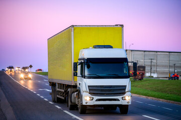 Yellow Cargo Truck on Highway – Freight Transport and Logistics