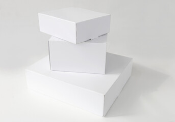 stacked white cardboard boxes on a white background