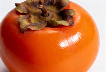 Ripe Persimmon Fruit on White Background in Close-Up(generated by AI)