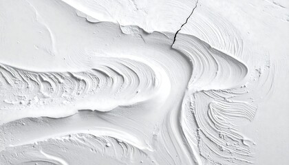 Abstract grayscale image features a textured surface with curved lines, ridges, and a crack, resembling flowing material