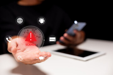 A hand extends with an alert symbol for scams, highlighting the importance of cybersecurity in the digital age with various communication icons in the background.