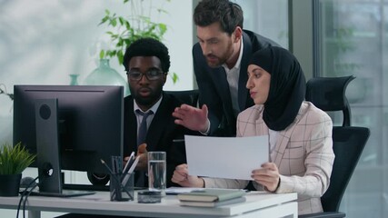 Multicultural business colleagues teamwork in office multiracial three co-workers working together diversity partners talking analyzing data in computer and papers documents meeting brainstorming - Powered by Adobe