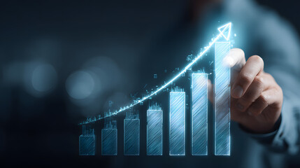 Hand drawing a glowing upward trending financial growth chart on a dark background