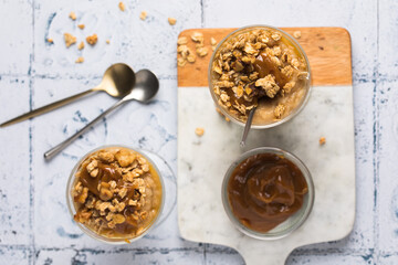 Apple caramel parfait with nuts in glass cups