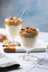 Apple caramel parfait with nuts in glass cups