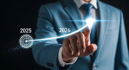 Obraz premium Businessman pointing at a glowing upward arrow graph showing growth from 2025 to 2026