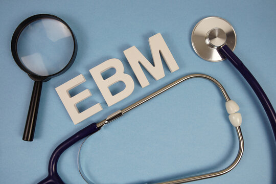 EBM abbreviation of Evidence Based Medicine alphabet letters with magnifying glass and stethoscope on blue background