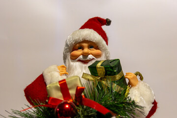 Childhood memories: Smiling Santa Claus with a red bow and green wrapping