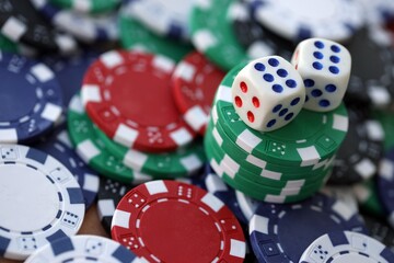 Dice game on the poker table in the casino. A successful combination of dice brought a lot of winning chips