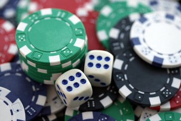 Dice game on the poker table in the casino. A successful combination of dice brought a lot of winning chips