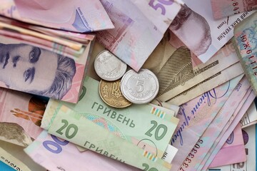 Big amount of different Ukrainian hryvnia money bills. Pile of crumpled ukrainian banknotes