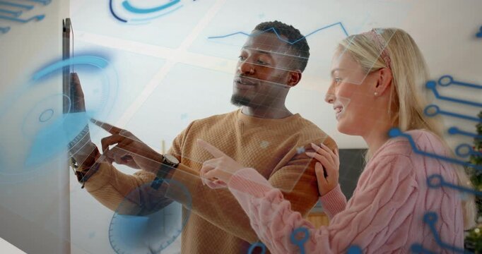 Technology lead tapping screen showing hologram as designer swiping and refining charts confirming