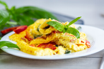 A simple breakfast with eggs, vegetables and herbs
