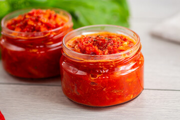 Hot homemade sauce with peppers, tomatoes and spices