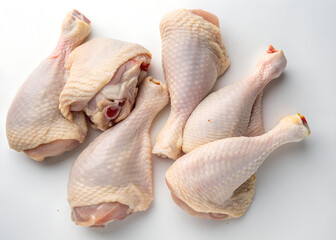 freshly cut raw chicken leg pieces. freshly cut halal raw chicken drumsticks