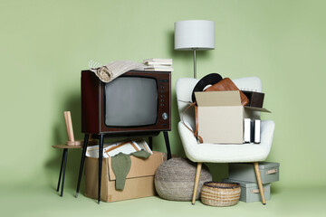 Garage sale. Different used stuff on green background