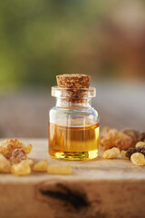 A bottle of frankincense essential oil with frankincense resin
