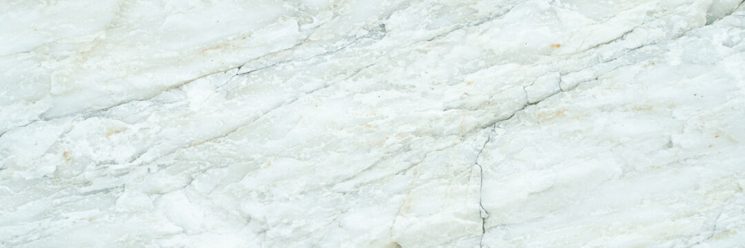 White marble texture with subtle veining and natural patterns for elegant interior design.