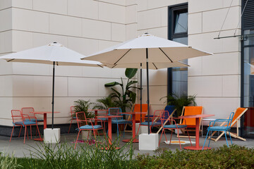 Enjoy a vibrant outdoor seating area with stylish, colorful furniture that offers charm