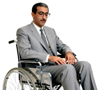 Somber Businessman in Wheelchair Looking Down in Thought
