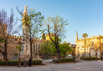 Triumph square with Alcazar walls and Archive of Indies, Seville, Spain