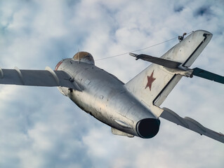 old Russian military fighter jet flies in the sky