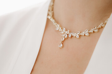 Woman putting on luxury jewelry, elegant accessories and fashion concept, stylish adornment for...
