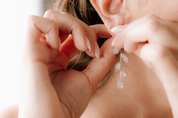 Woman putting on luxury jewelry, elegant accessories and fashion concept, stylish adornment for...