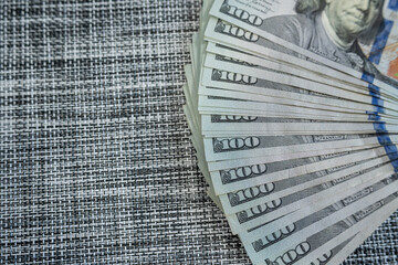 Magnifying glass over dollar bills – Financial audit, money analysis or fraud investigation concept