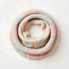 Pastel knitted balaclava on light background, modern minimalist accessory