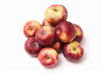 Group of red apples isolated on white background. Fresh fruits full of vitamins and fiber. Natural organic harvest from orchard. Healthy diet ingredient and minimal food composition.