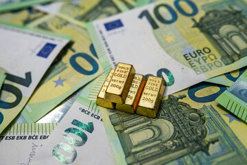 Euro banknotes with gold bars, investment, financial growth, fortune and wealth concept