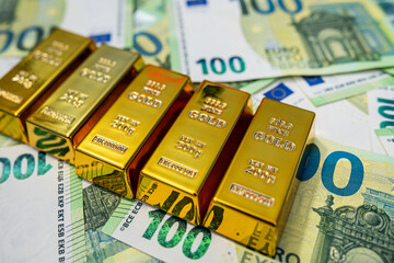 Gold bars on euro banknotes, wealth, finance, investment and business success concept