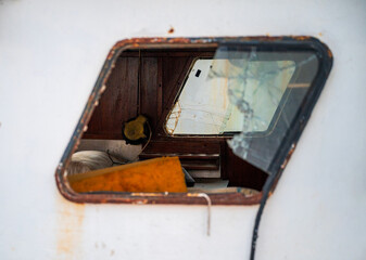 Broken Window on an Abandoned Fishing Boat Cabin