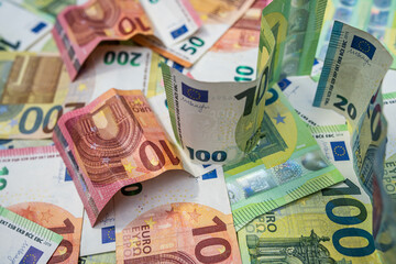 Mix of euro banknotes representing European finance, global economy, business investment and trade.
